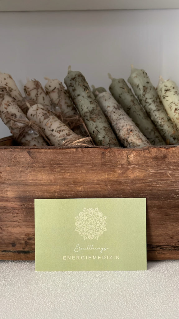 a box of candles with a card