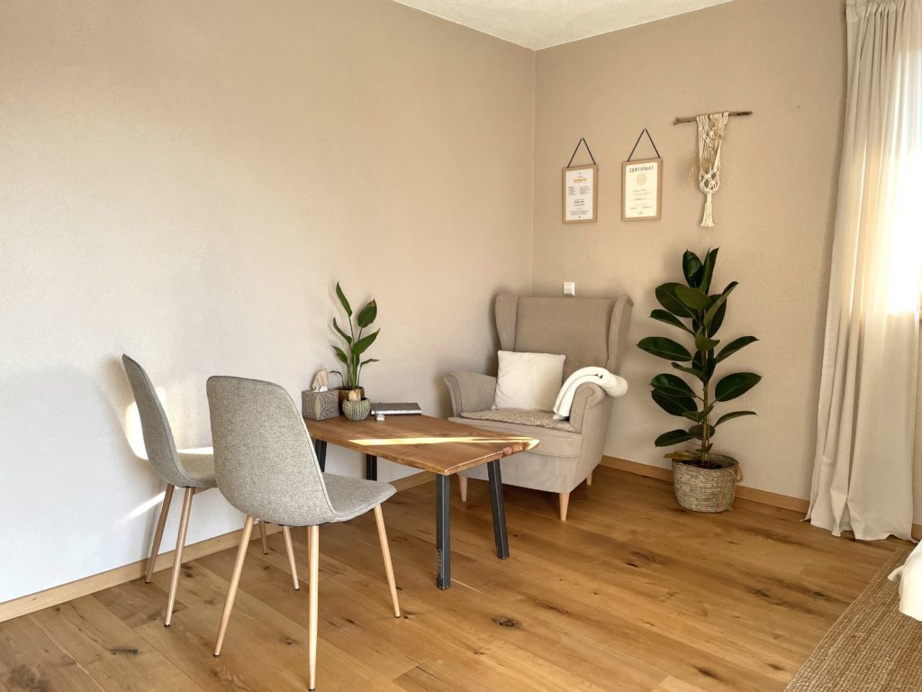 a room with a table and chairs